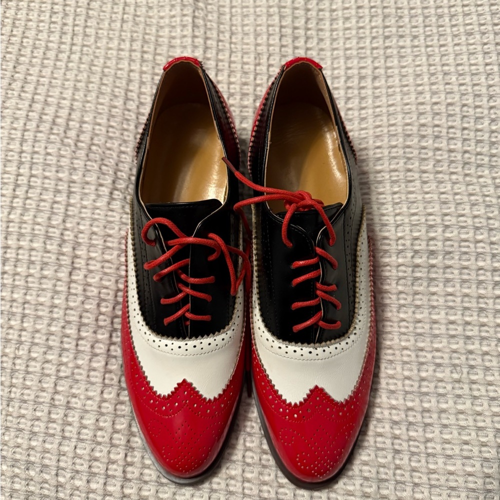 Size 8.5 red, white and black vintage like shoes. New, never worn